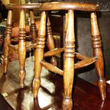 A near pair of early 19th century ash and elm stools (2).