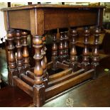 A 20th century oak nest of three tables, the largest 56cm wide.