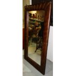 A 20th century brown leather wall mirror, 163cm wide.