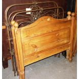 A 20th century pine single bed and a pair of steel single beds.