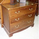 An Edwardian mahogany crossbanded chest of three long drawers,