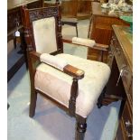 A 19th century mahogany upholstered open armchair.