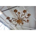 A French ormolu eight branch chandelier, early 20th century, with all over foliate cast decoration,