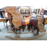 A stained and carved pitch pine rocking horse, adult size, late 20th century,