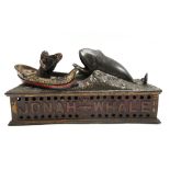 A polychrome painted cast iron 'Jonah and the whale' money box, circa 1890, by Shephard Hardware,
