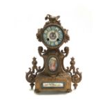 A French gilt metal and porcelain mounted mantel clock, 19th century,