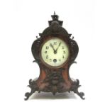 A German walnut cased mantel timepiece, late 19th/early 20th century,