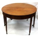 A George III mahogany 'D' end dining table, with moulded edge, having two extra leaves,