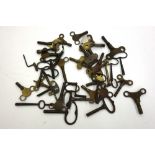 A collection of forty brass and steel mantel, bracket, carriage and longcase clock keys,