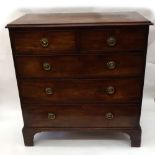 A George III mahogany chest, the crossbanded top above two short and three long drawers,