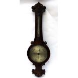 Salom & Co Edinburgh & London: a Victorian figured walnut cased wheel barometer thermometer,