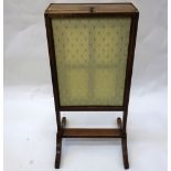 A Regency mahogany ebony strung fire screen, with an upholstered rectangular telescopic panel ,