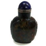 A Chinese carved green and rust speckled quartz snuff bottle,