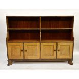A fine Cuban mahogany and macassar ebony bookcase, with cupboards below, by Peter Waals, 1934,