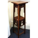 Attributed to Liberty & Co: a walnut two tier plant stand,