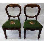 A pair of Victorian mahogany balloon back campaign dining chairs,