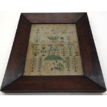 A needlework sampler, worked with an alphabet, figures, topiary, formal trees and animals,