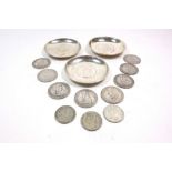 Three Chinese silver circular dishes, 20th century, each inset with a Chinese coin, 9.