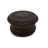 A turned and carved circular ebony and hardwood snuff box, late 19th century,