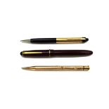 A Sheaffers propelling pencil in black and gilt, stamped 1/10 14k Y.G.F.