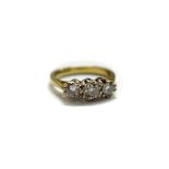 An 18ct gold and diamond set three stone