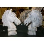 A pair of 20th century carved marble horse's heads 30cm tall, (2).