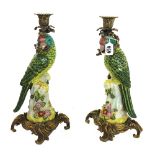 A pair of modern porcelain and brass mounted candlesticks, probably German,