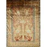 A silk Heriz tree of life rug, the dark madder field with a flowering tree,