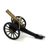 A gilt and patinated metal and wood working scale model of a late-19th century American Gatling gun,