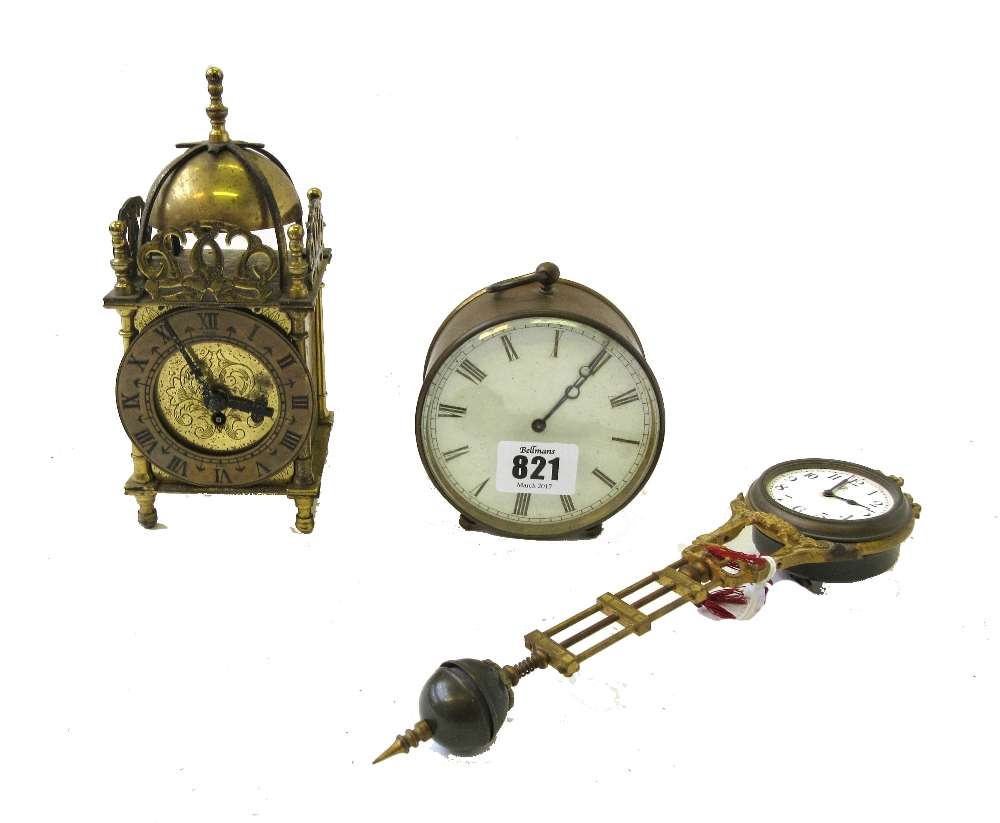 A French brass drum cased mantel clock, with white enamel dial and two feet, 9.