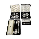 A set of six silver grapefruit spoons, Sheffield 1934, a pair of salad servers,