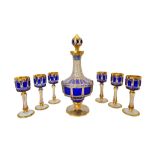 A Moser style gilt and blue flashed cut glass liqueur set, early 20th century,