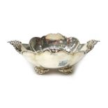 An Italian silver twin handled bowl, of shaped oval form, with floral decoration to the handles,