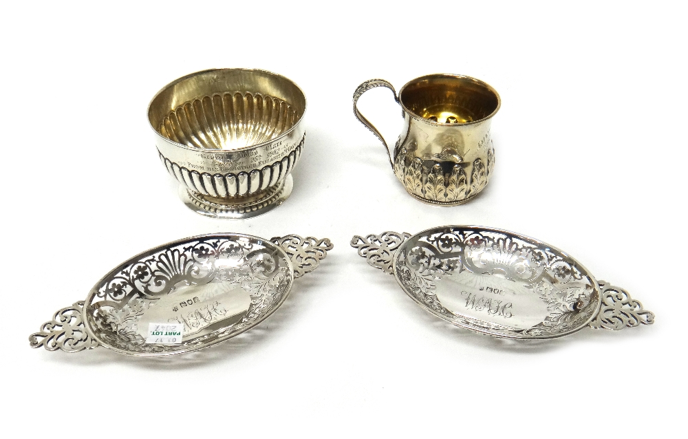 Silver, comprising; a pair of oval twin handled dishes, having pierced decoration, London 1904,