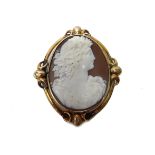 A Victorian gold mounted oval shell cameo brooch, carved as the portrait of a classical lady,