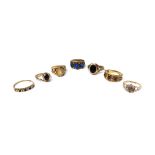 A 9ct gold and garnet set three stone ring, a gold and blue gem set three stone ring, detailed 9 CT,