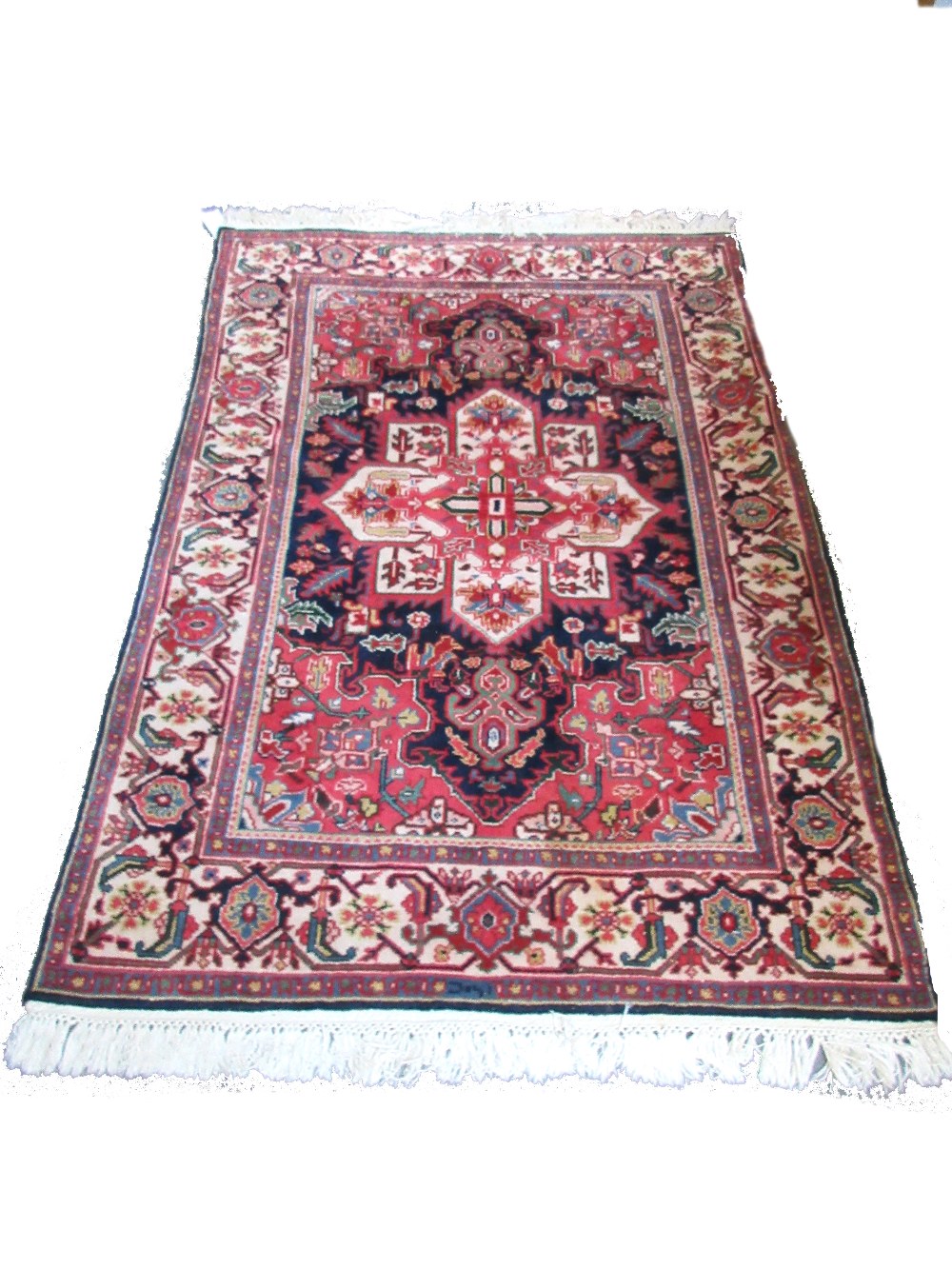 A Mahal rug, Persian, the black field with a bold ivory medallion, madder spandrels,