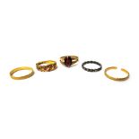 A 15ct gold ring, mounted with two cushion shaped rubies, (three further central gems lacking),