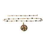 A gold, sapphire, cat's eye, emerald and gem set pendant of circular openwork form, a gold,