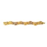 An 18ct gold bracelet, the curved links with a cast and textured marine style finish,