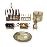 Silver, comprising; an oval hinge lidded tea caddy, Birmingham 1919, a five bar toast rack,