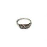 A platinum and diamond three stone ring,