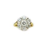 An 18ct gold and diamond set seven stone cluster ring,