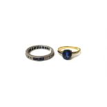 A gold ring, claw set with an oval cut sapphire,