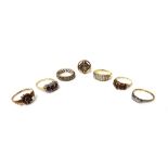 A gold and platinum, diamond set three stone ring, mounted with circular cut diamonds,