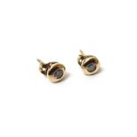 A pair of gold and diamond set single stone earstuds, each mounted with a circular cut diamond,