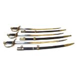 Three French cavalry sabres, early 19th century, each with curved steel blade,