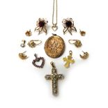 A pair of gold and garnet set earstuds, the backs with post and butterfly clip fittings,