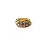 A Victorian 18ct gold and seed pearl set ring, mounted with two rows of seed pearls, Chester 1881,