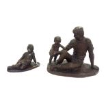 A composite bronze figure group, modern, depicting a father and child on a shaped base,